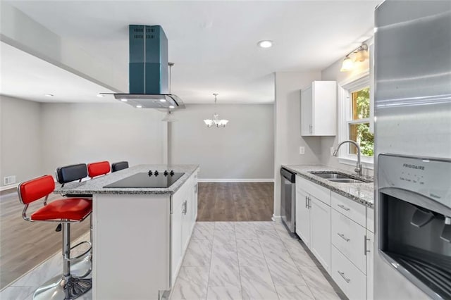 kitchen with white cabinets, stainless steel appliances, sink, island exhaust hood, and a breakfast bar