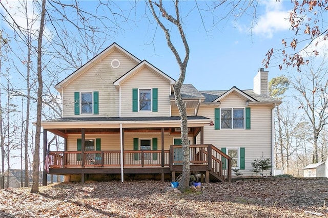 view of front of home featuring a porch and a chimney