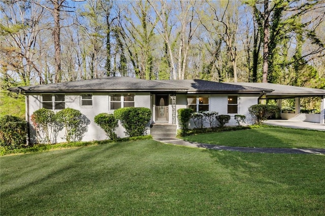 single story home with a front yard and a carport