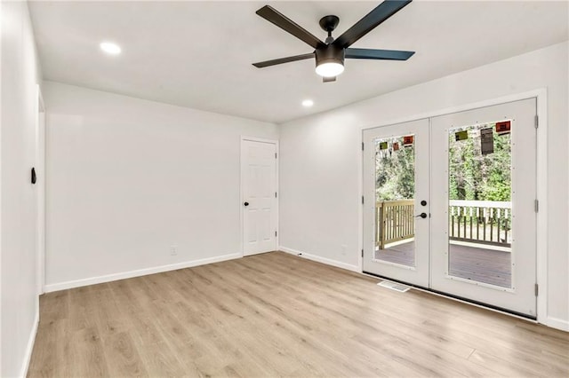 unfurnished room with light wood-type flooring, ceiling fan, and french doors