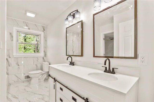 bathroom with vanity and toilet