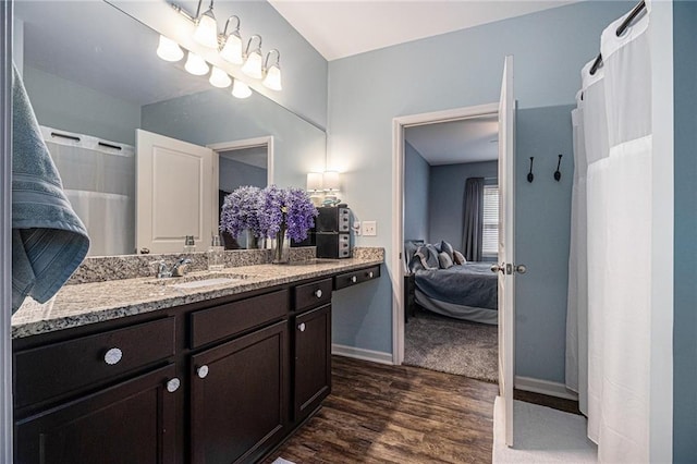 23 Stable Gate Dr, Cartersville, GA 30120 - full bath with connected bathroom, wood finished floors, vanity, and a shower with shower curtain