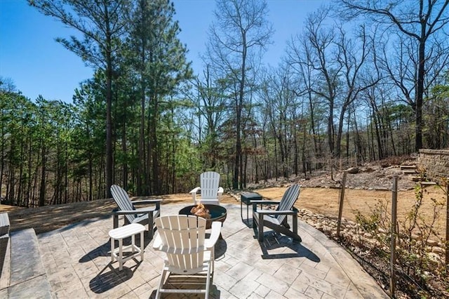 view of patio / terrace featuring a fire pit