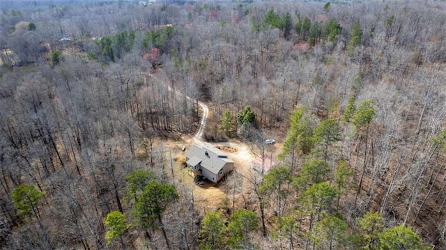 drone / aerial view featuring a forest view