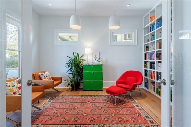 1601 Marlbrook Dr NE, Atlanta, GA 30307 - sitting room with wood finished floors and baseboards