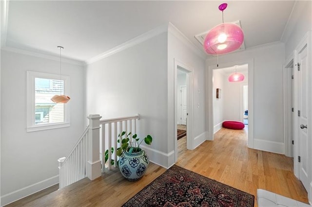 1601 Marlbrook Dr NE, Atlanta, GA 30307 - hallway with an upstairs landing, crown molding, light wood finished floors, and baseboards