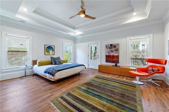 1601 Marlbrook Dr NE, Atlanta, GA 30307 - bedroom featuring a raised ceiling, ornamental molding, wood finished floors, baseboards, and ceiling fan
