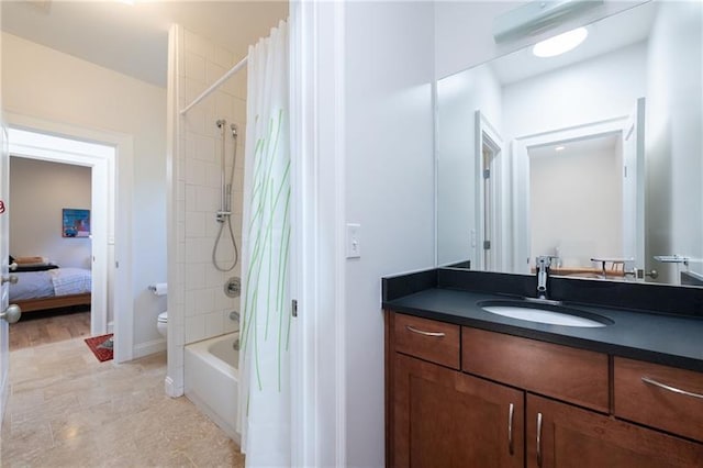 1601 Marlbrook Dr NE, Atlanta, GA 30307 - bathroom featuring vanity, shower / bath combo with shower curtain, toilet, connected bathroom, and baseboards