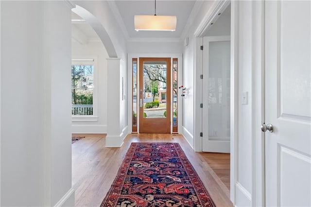 1601 Marlbrook Dr NE, Atlanta, GA 30307 - entrance foyer with light wood finished floors, arched walkways, baseboards, and ornamental molding
