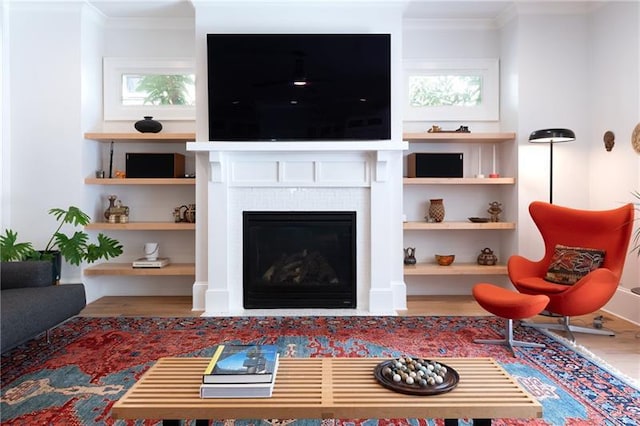 1601 Marlbrook Dr NE, Atlanta, GA 30307 - living area with wood finished floors, crown molding, and a tile fireplace