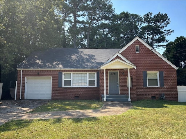 view of front of house featuring a front yard and a garage