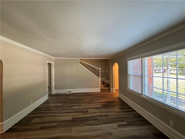 unfurnished room with crown molding and dark hardwood / wood-style floors