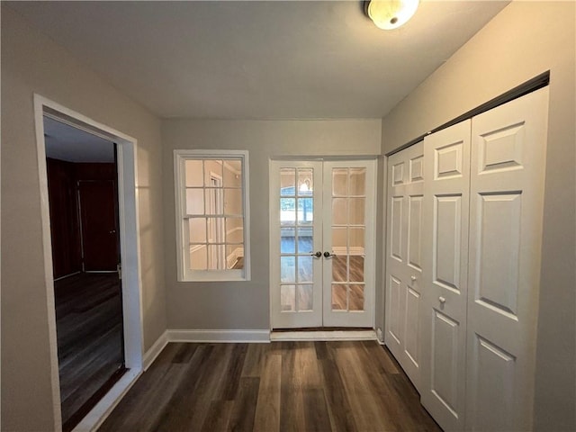 doorway with french doors and dark hardwood / wood-style flooring