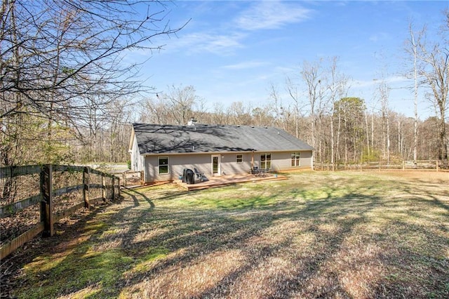 view of yard featuring a deck and a fenced backyard