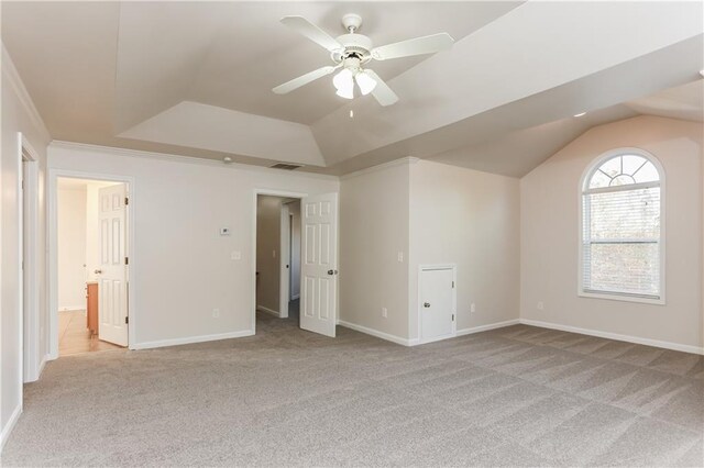 unfurnished bedroom with ceiling fan, light colored carpet, and lofted ceiling