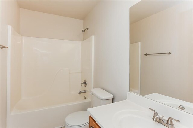 full bathroom featuring vanity,  shower combination, and toilet