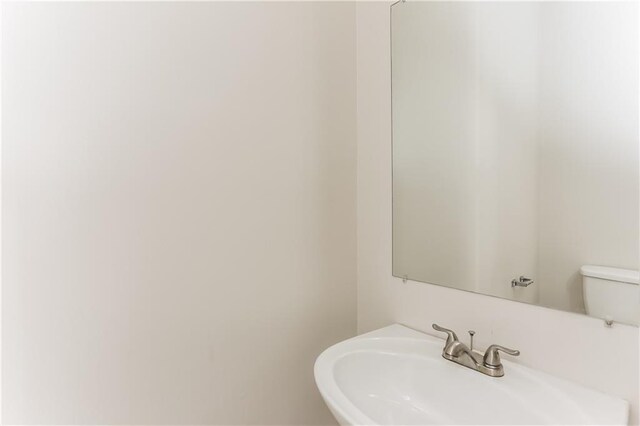 bathroom featuring sink and toilet