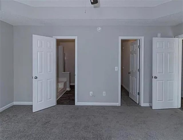 6030 Creekside Dr, Columbus, GA 31907 - unfurnished bedroom with carpet floors, baseboards, a spacious closet, and ensuite bathroom