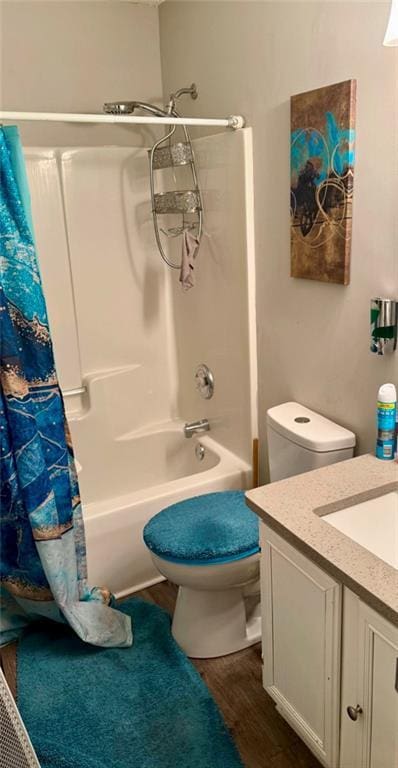 6030 Creekside Dr, Columbus, GA 31907 - bathroom featuring vanity, toilet, wood finished floors, and shower / bath combo with shower curtain