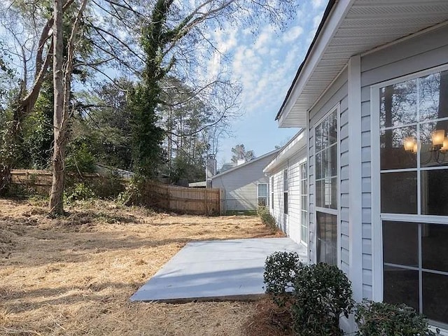 6030 Creekside Dr, Columbus, GA 31907 - view of side of home featuring fence and a patio