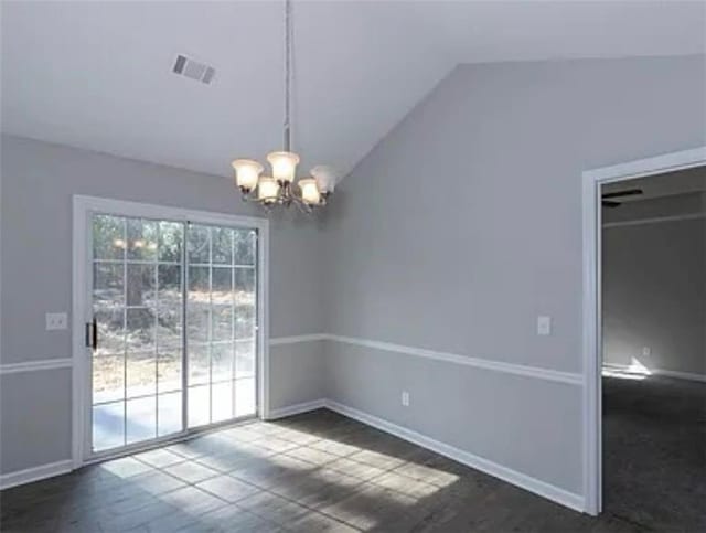 6030 Creekside Dr, Columbus, GA 31907 - unfurnished dining area featuring visible vents, baseboards, dark wood finished floors, a notable chandelier, and vaulted ceiling