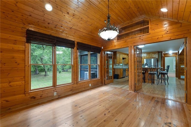 442 Cartecay River Run, Ellijay, GA 30536 - unfurnished dining area featuring wooden ceiling, wooden walls, lofted ceiling, and hardwood / wood-style flooring
