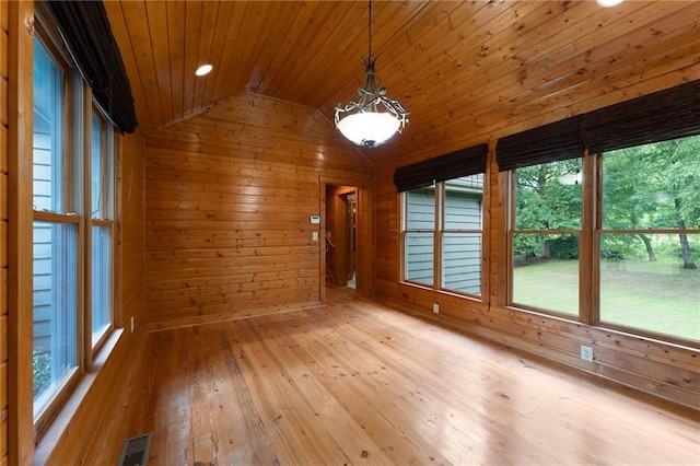 442 Cartecay River Run, Ellijay, GA 30536 - empty room featuring lofted ceiling, wood walls, wood ceiling, healthy amount of natural light, and light wood finished floors