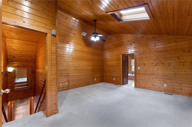 442 Cartecay River Run, Ellijay, GA 30536 - unfurnished room featuring lofted ceiling, wooden walls, a skylight, wood ceiling, and carpet flooring