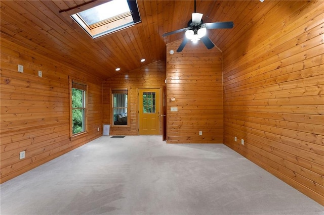442 Cartecay River Run, Ellijay, GA 30536 - unfurnished room with wooden ceiling, a skylight, wooden walls, carpet flooring, and a ceiling fan
