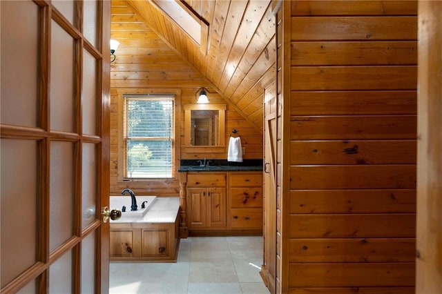 442 Cartecay River Run, Ellijay, GA 30536 - bathroom with vanity, a skylight, wood walls, a bath, and vaulted ceiling