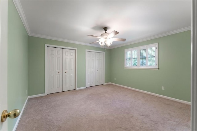 442 Cartecay River Run, Ellijay, GA 30536 - unfurnished bedroom with carpet floors, crown molding, two closets, and baseboards