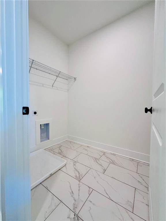 clothes washing area with baseboards, laundry area, hookup for a washing machine, marble finish floor, and electric dryer hookup