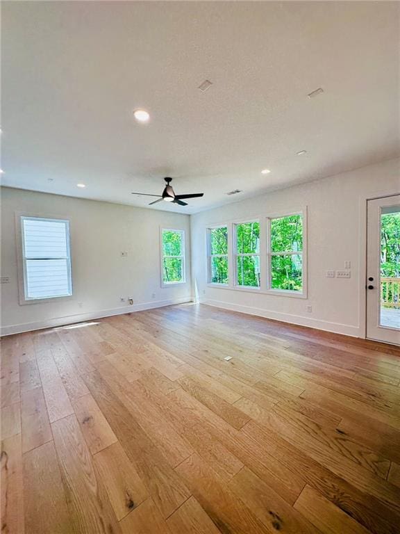 unfurnished room featuring ceiling fan, baseboards, light wood-style flooring, and recessed lighting