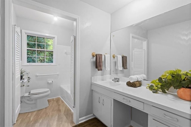 full bathroom with  shower combination, vanity, and toilet