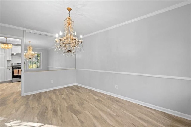 unfurnished dining area with a chandelier, crown molding, light wood finished floors, and baseboards