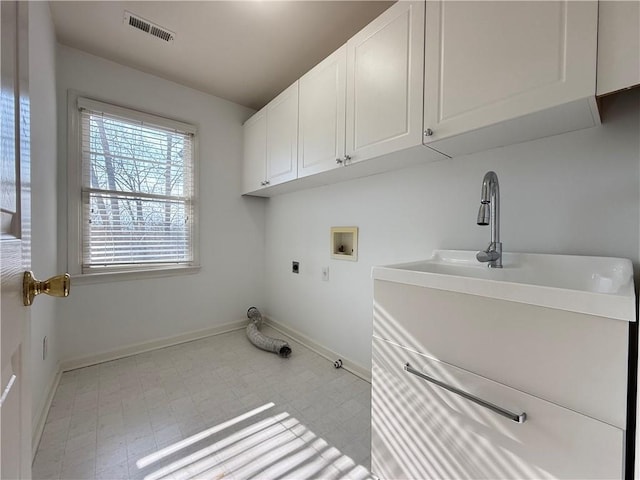 laundry area with cabinets, hookup for a washing machine, and electric dryer hookup