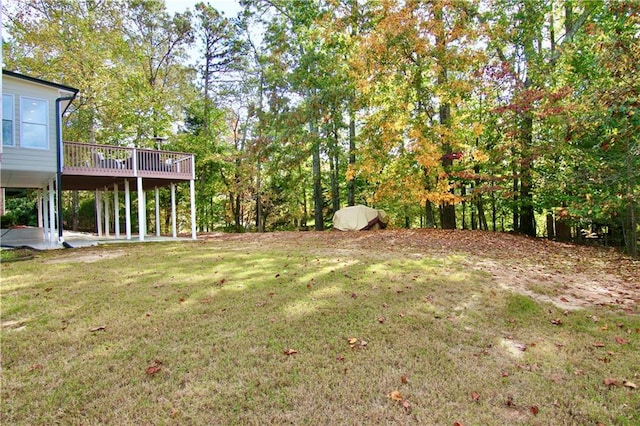 view of yard with a wooden deck