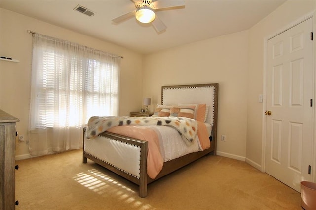 carpeted bedroom featuring ceiling fan