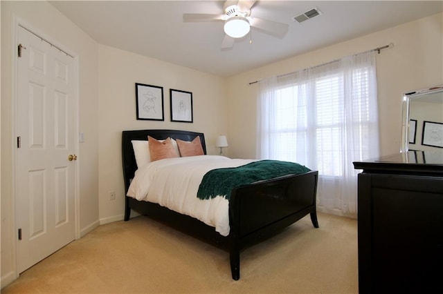 carpeted bedroom with ceiling fan