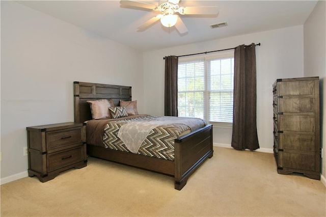 bedroom featuring light carpet and ceiling fan