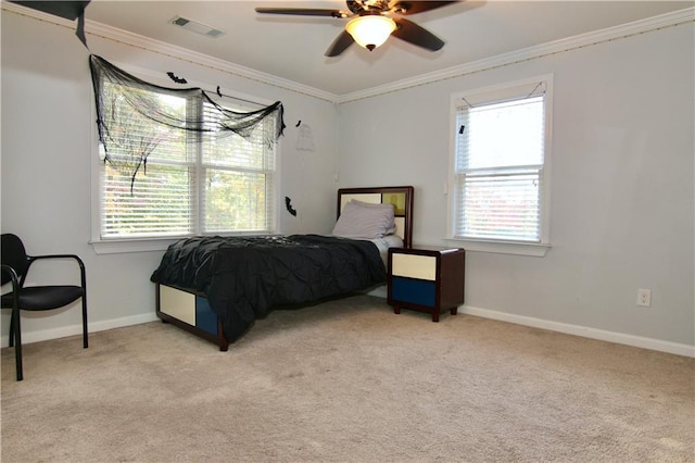 bedroom with multiple windows, crown molding, and light carpet