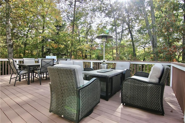 wooden deck with an outdoor living space