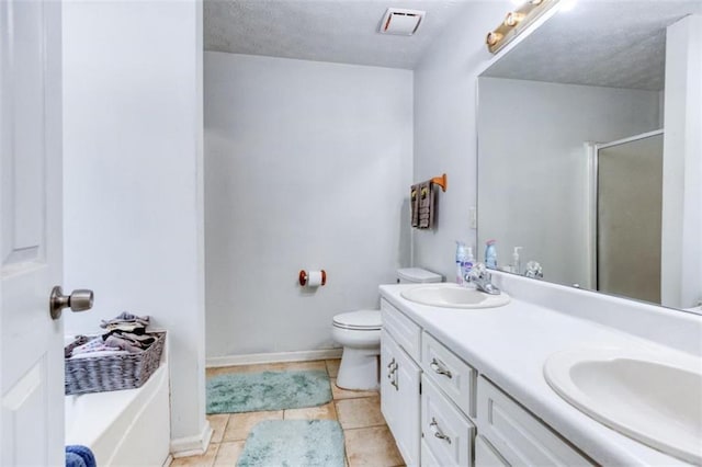 1015 Carriage Way, Loganville, GA 30052 - full bath with a shower stall, double vanity, toilet, tile patterned flooring, and a tub