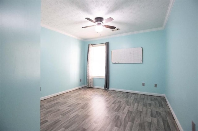 1015 Carriage Way, Loganville, GA 30052 - unfurnished room featuring wood finished floors, a ceiling fan, a textured ceiling, crown molding, and baseboards