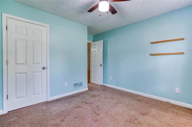 1015 Carriage Way, Loganville, GA 30052 - unfurnished bedroom with carpet flooring, baseboards, and ceiling fan