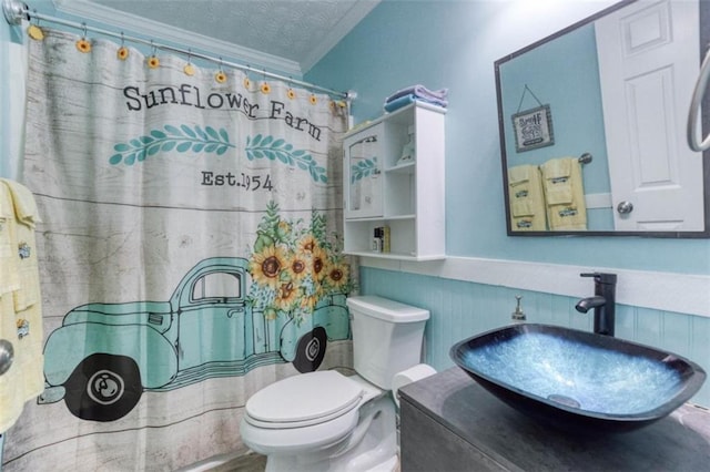 1015 Carriage Way, Loganville, GA 30052 - full bath with toilet, crown molding, a textured ceiling, a shower with shower curtain, and vanity