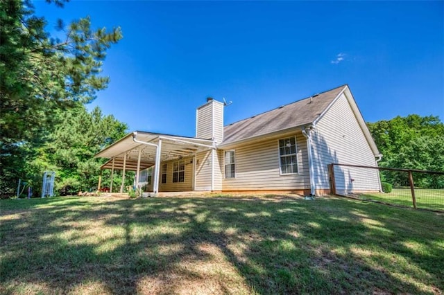1015 Carriage Way, Loganville, GA 30052 - back of property featuring a chimney