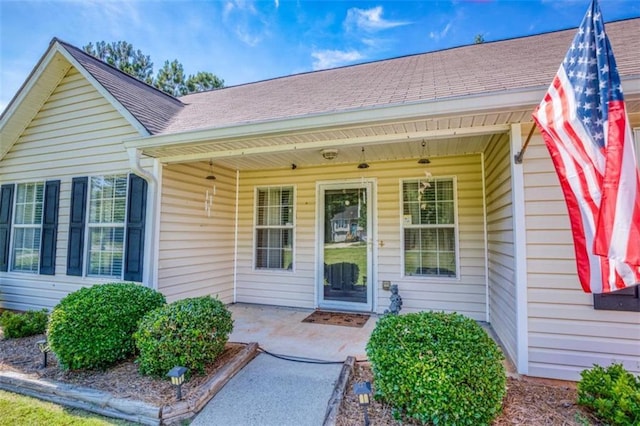 1015 Carriage Way, Loganville, GA 30052 - entrance to property featuring roof with shingles