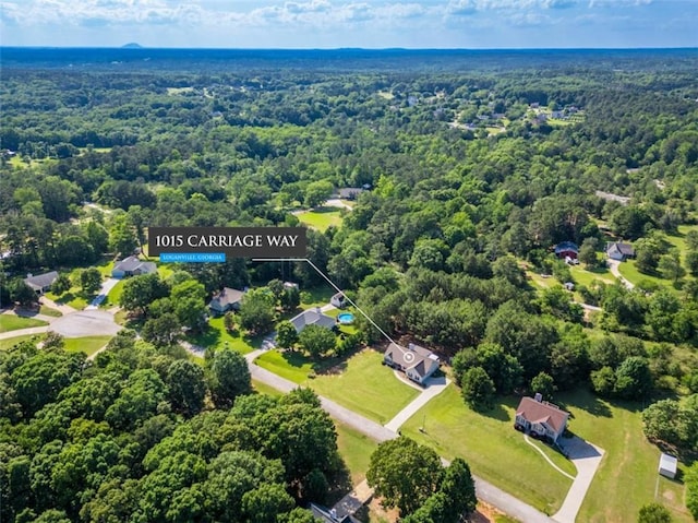1015 Carriage Way, Loganville, GA 30052 - aerial view of a heavily wooded area