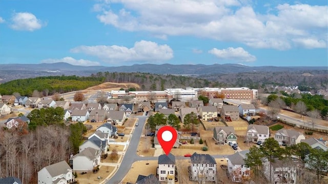 birds eye view of property with a residential view and a mountain view